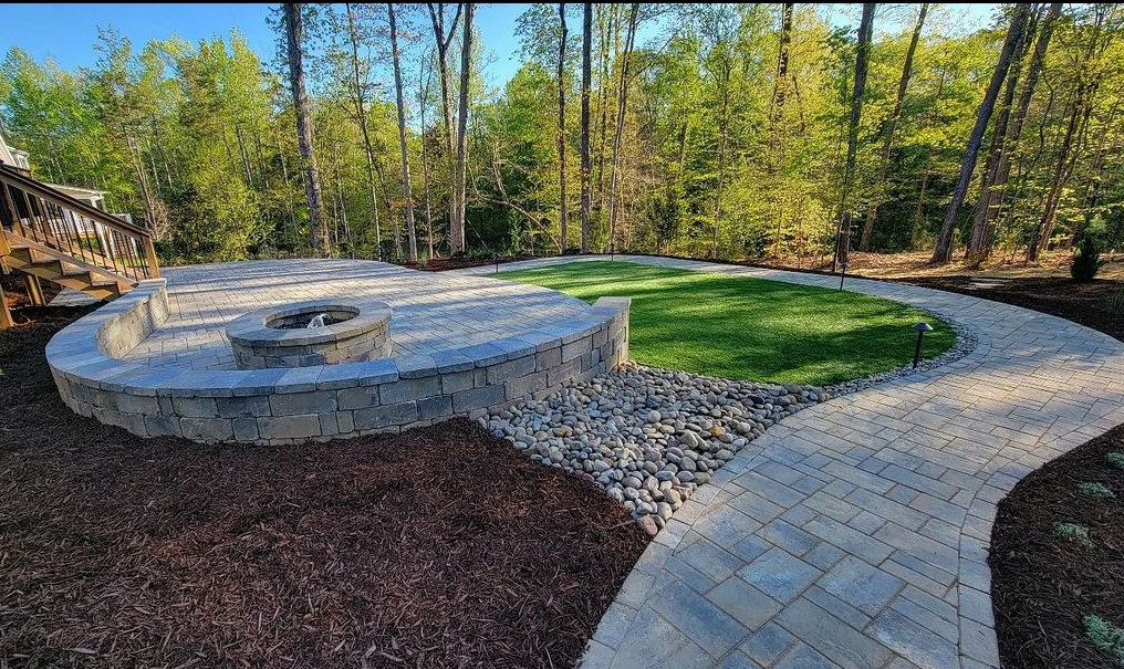 Charlotte backyard with fire pit, patio, walkway, landscape lighting and more