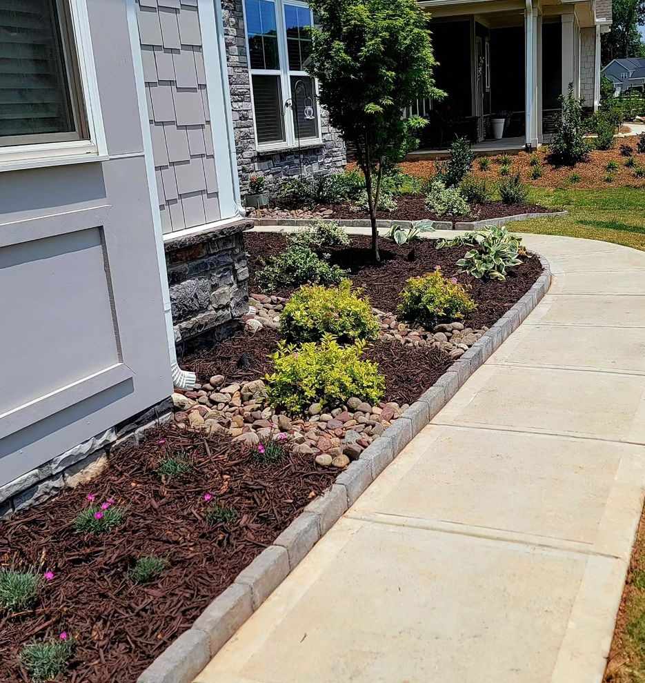 Paver edging along sidewalk and curb appeal planting