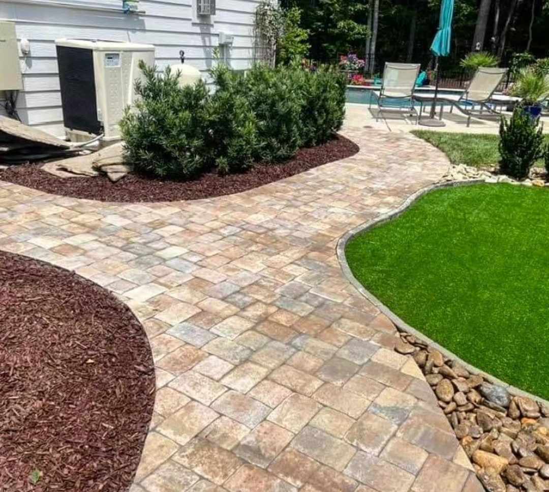 Paver walkway around pool in Charlotte yard